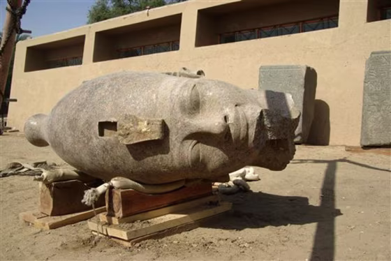 Egypt's Culture Ministry says a team of Egyptian and European archaeologists has unearthed a large head made of red granite of an ancient pharaoh who ruled Egypt some 3,400 years ago.